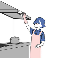 換気扇を掃除する女性