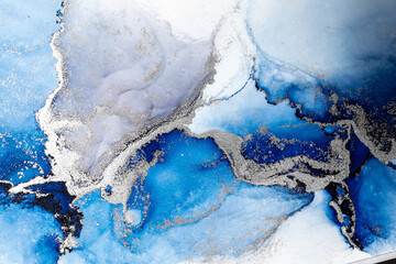 Blue silver abstract background of marble liquid ink art painting on paper . Image of original artwork watercolor alcohol ink paint on high quality paper texture .