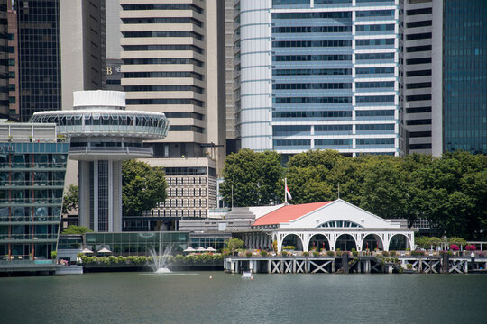 The Clifford Pier with red roof with Singapore CBD as background