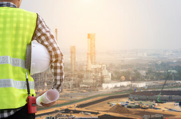Engineer supervising the construction of an oil refinery