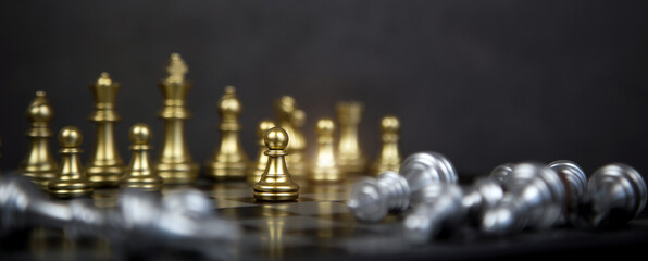 Chess stand on chessboard concept of team player or business team and leadership strategy and human resources organization management or goal to win or strong winner.