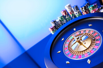 Casino theme.  Gambling games. Roulette and poker chips on a blue background.