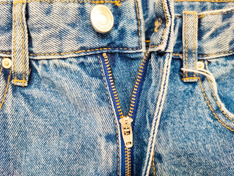 Close Up Shot Of Man In Jeans With Open Zipper. Unbuttoned Blue