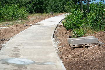 Construction of a path (pavement) for cyclists and people in the park.