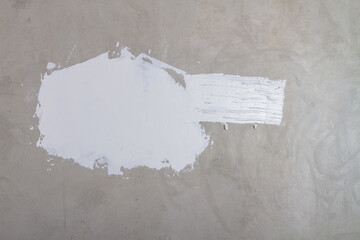 Texture of raw putty on a white wall