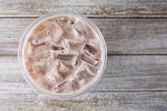 A Top Down View Of An Iced Milk Tea Beverage.