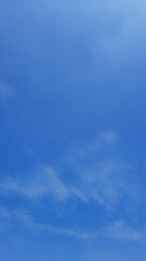 Blue sky background with thin clouds in Indonesian sky
