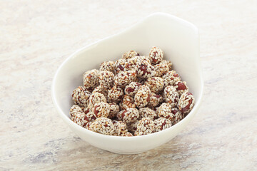 Sweet peanut in sesame seeds