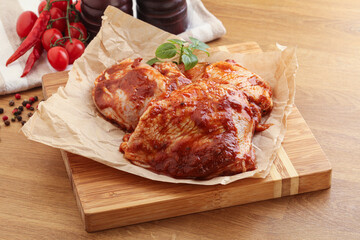 Marinated chicken leg in tomato sauce