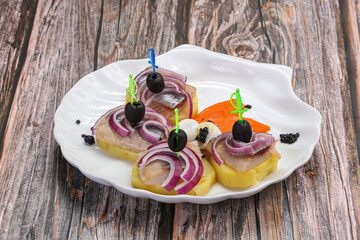 Herring fillet snack with potato