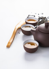 teapot and cup of tea on wooden table