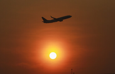 The plane took to the skies at noon on a summer vacation.
