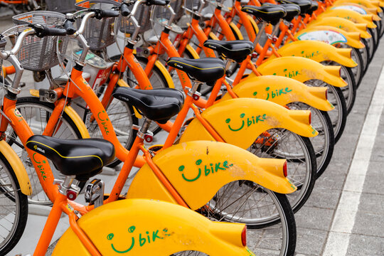 NEW TAIPEI CITY, TAIWAN - APRIL 30, 2022: YouBikes parked at bike sharing station. A bike sharing system service in Taiwan.