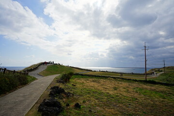 Fototapeta na wymiar seaside walkway and clouds