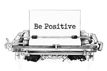 Be Positive typed words on a Vintage Typewriter.
