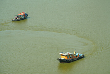 Two boats on the Chao Phraya River, Bangkok, Thailand, taken on July 4, 2018.