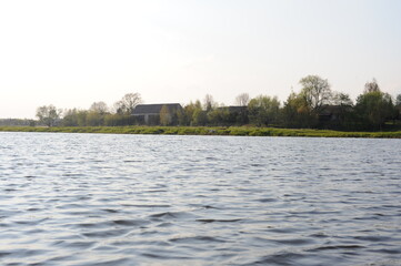 Green banks of Bug river in a beautiful rural countryside in Mazovia district of Poland, Europe