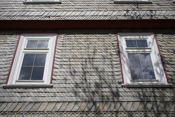 Old historic buildings from the Middle Ages, covered with slabs of slate to protect against heat and cold. Goslar, Germany.