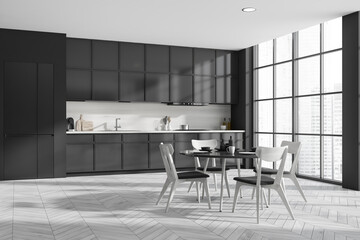 Corner view on dark kitchen room interior with dining table