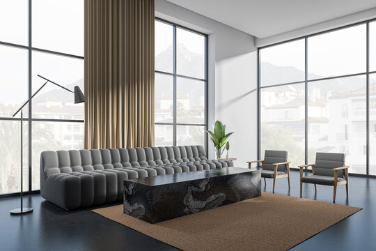 Light relax room interior with sofa and coffee table, panoramic window