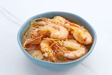 Udang Asam Manis, Sweet and sour shrimp, Indonesian food, seasoned with tomato and chilli sauce. Served in a bowl, close up.

