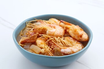 Udang Asam Manis, Sweet and sour shrimp, Indonesian food, seasoned with tomato and chilli sauce. Served in a bowl, close up.
