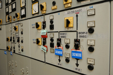 Switches toggles tumblers of switching electricity on the main control board in a control operations room of the reactor of the Chernobyl Nuclear Power Plant