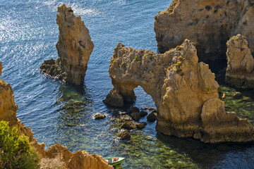 Fototapeta na wymiar Panoramic view with Cliff, rocks and emerald sea at Ponta da Piedade near Lagos, Algarve, Portugal