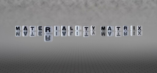 materiality matrix word or concept represented by black and white letter cubes on a grey horizon background stretching to infinity