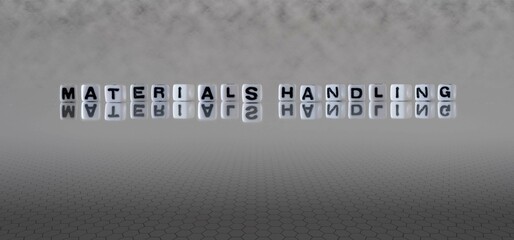 materials handling word or concept represented by black and white letter cubes on a grey horizon background stretching to infinity