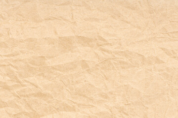 Crumpled paper texture background. Light brown color