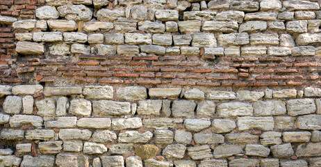 old stone wall texture background, front view
