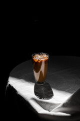 glass of iced coffee with milk on the table