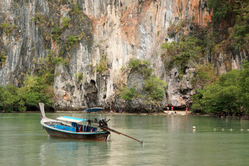 Fototapeta na wymiar Landscape Thai traditional long tail boat in Railay Ao nang Krabi Thailand - sunny day summer Transport 