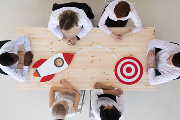Business people rocket and target