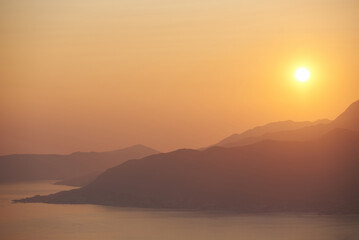 Landscape with sunset, sea and mountains in Montenegro