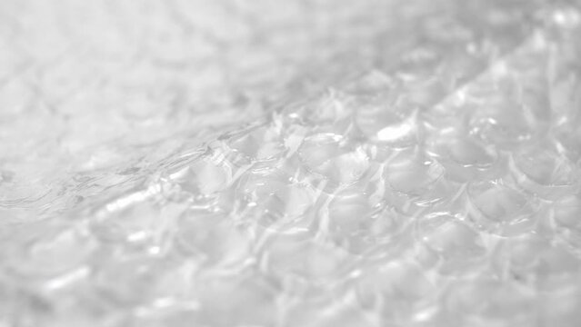 Polyethylene packaging bubble wrap texture. Macro. Rotation