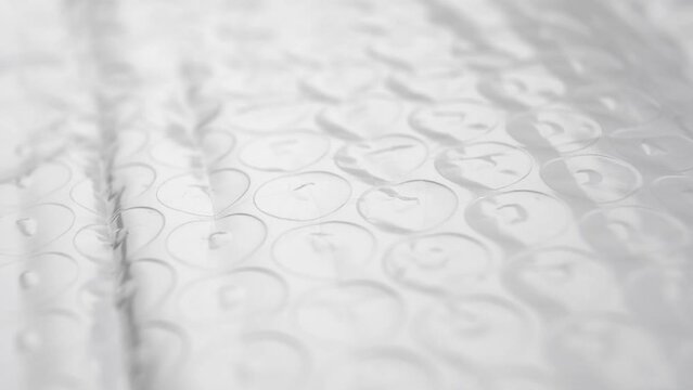 Polyethylene packaging protective bubble wrap texture. Extreme close up. Rotation