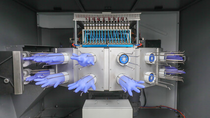 Nitrile glove gas inspection equipment is in operation in a processing plant, China