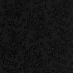 Black lace fabric with a floral ornament. Luxury background in vintage style.
