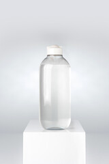 mockup with clean bottle of micellar water on white pedestal