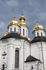 Fototapeta na wymiar Catherine's Church is a functioning church in Chernihiv, Ukraine. St. Catherine's Church was built in the Cossack period and is distinguished by its five gold domes in the Baroque style.