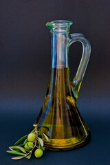 olive oil bottle on black background