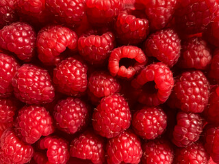 Raspberry background. Full frame textured berry background. Healthy lifestyle and healthy eating concept. Summer 