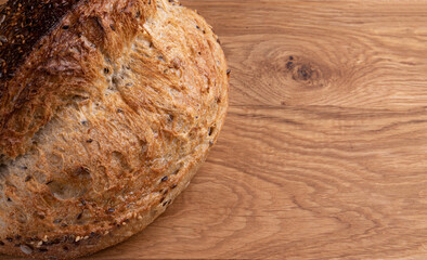 fresh homemade bread on wooden background, side view