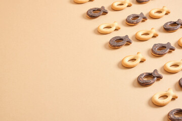 pattern of cookies in the shape of a fish on a beige background