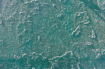 A part of old steel roof painted many times and with frost on it