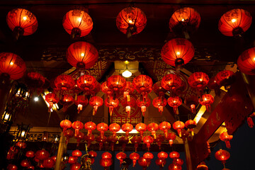 Red lanterns hanging on Chinese temple roof