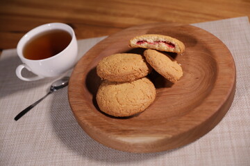 berry tea and a decorative wooden plate is very beautiful for vegetables and cookies, sweets and desserts as an element of decor for interior design