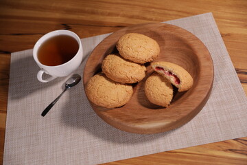 berry tea and a decorative wooden plate is very beautiful for vegetables and cookies, sweets and desserts as an element of decor for interior design